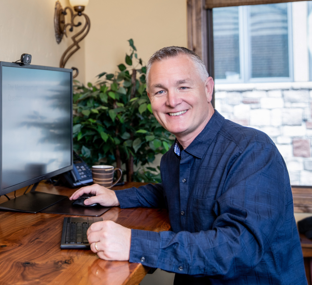 John Ramstead working at his desk