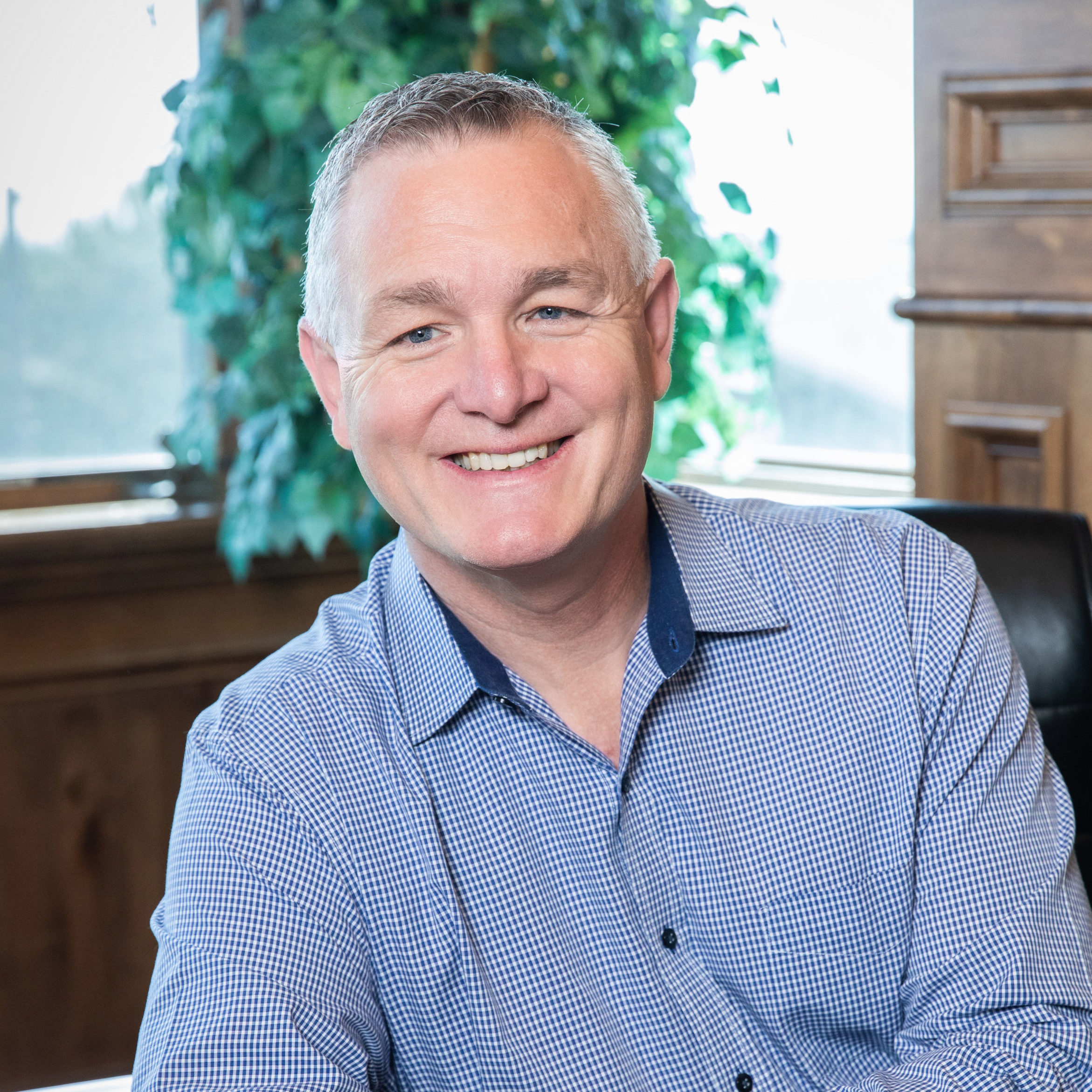 John Ramstead smiling in an office